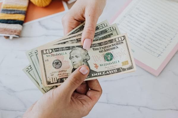 Two people exchanging money