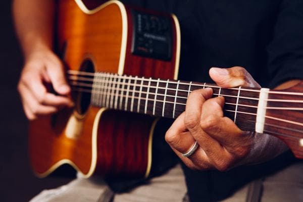 Person playing a guitar